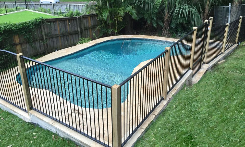 Flat Top Pool Fencing between timber posts